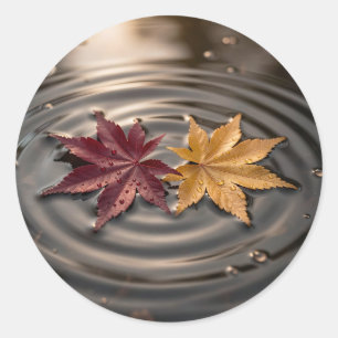 Herfst esdoornbladeren drijvend op water ronde sticker
