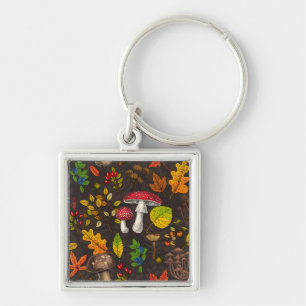 Herfst paddenstoelen, bladeren, noten en bessen op sleutelhanger