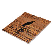 Héron au carreau de céramique de coucher du soleil (Côté)