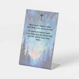 Het bedtijdgebed van een kind op een voetstuk reclamebord met voetstuk