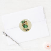 Het dragen van de groene ronde sticker (Envelop)
