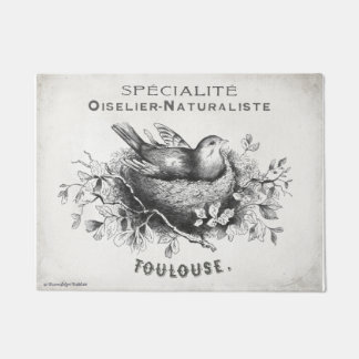 Het Franse doormat met vogel in het nest. Deurmat