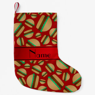 Het gepersonaliseerde patroon van de naam rode kleine kerstsok