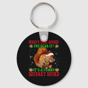 Het is een leuke piepende geluid kerst eekhoorn sleutelhanger