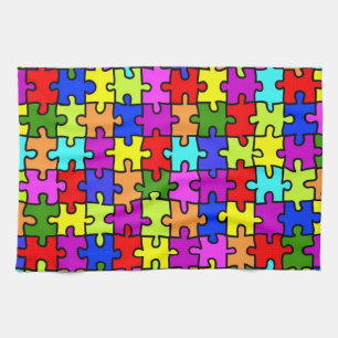 Het kleurrijke patroon van de regenboogpuzzel theedoek