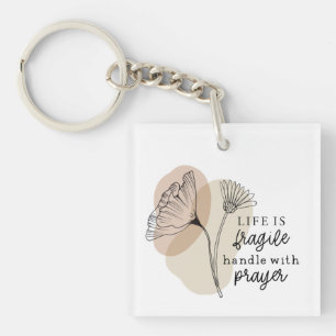 Het leven is een breekbaar handvat met gebedsbloem sleutelhanger