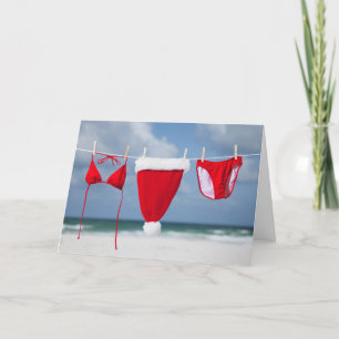 Het pet en de bikini van de kerstman op een feestdagen kaart