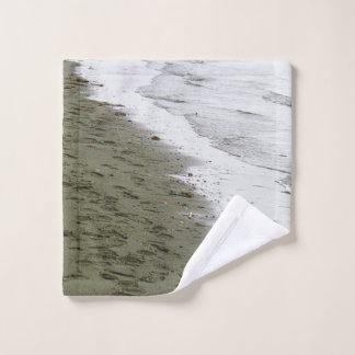 Het water voldoet aan voetafdrukken washandje