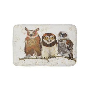 Hiboux dans un tapis de bain de rangée