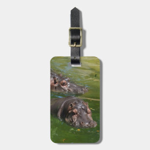 Hippos zwemmen in een hond, bagagelabel