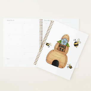 Hive d'abeille au miel avec fleurs bleues et abeil