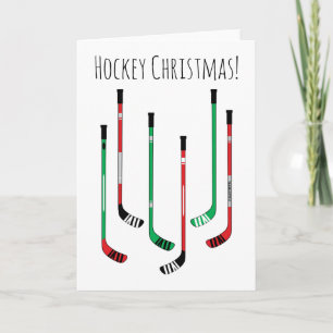 Hockey-kerstrood en groene ockey-sticks feestdagen kaart