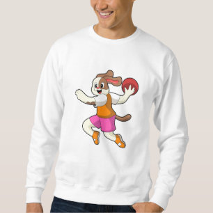 Hond bij Handbalspeler met handbal Trui