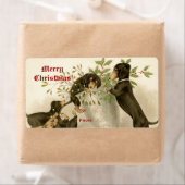 Honden spelen met Kerstmis maretak & heilige bes Etiket (Insitu)