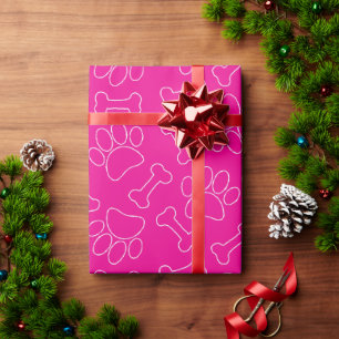 Hondenpoot en botten tekenpatroon op hete roze cadeaupapier