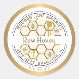 Honingraatdruppels en het rauwe honingetiket voor  ronde sticker