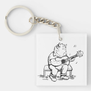 Hooglandkoe speelt akoestische gitaar sleutelhanger
