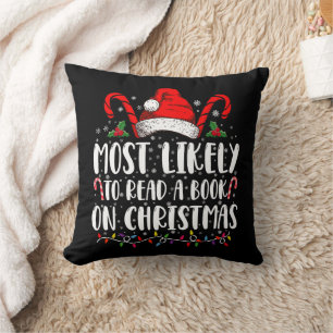 Hoogstwaarschijnlijk leest een boek met Kerstmis  Kussen