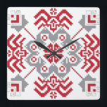 Horloge Carrée Auseklis letton Médaillon géométrique d'art popula<br><div class="desc">Dans le folklore letton,  le soleil ou l'étoile Auseklis-Morning symbolise la lumière qui domine dans la lutte pour l'obscurité. Ce symbole protège et s'oppose à l'énergie négative. Le motif est dans les tons traditionnels lettons,  rouge et gris lin. 
 
Un cadeau parfait pour un amateur letton,  païen et folklorique ;)</div>
