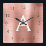 Horloge Carrée Blush Pink - Rose Gold Metallic Monogram Nom<br><div class="desc">Blush Pink - Rose Gold Faux Stainless Steel Foil Monogram Name and Initial Custom Unique Wall Clock for the House or Office. The Wall Clock makes the perfect Christmas or Sweet 16,  18th,  21st,  30th,  40th,  50th ou 60th Birthday vend for someone who loves pink métallc decor.</div>