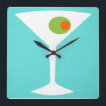 Horloge Carrée Classic Movie Martini Wall Clock<br><div class="desc">This Classic Movie Martini Wall Clock fets a turquoise background and the white silhouette of a martini glass. Inside the glass is a glorious green olive with an orange pimento. This is a fun wall clock for everyone who wishes they were a character in a classic movie. Shaken not stirred...</div>