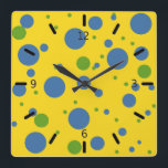Horloge Carrée Clock Green and Blue Spotted Wall<br><div class="desc">What fun design for a clock ! Yellow background with blue and green spots scattered all about. C'est rétro, c'est hip, c'est colorful, c'est trendy, et c'est parfait pour a teen's room, a dorm room, a kitchen, or a family room. This clock would make in unforgettable housewarming or boatwarming (or...</div>