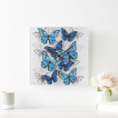 Horloge Carrée Composition de papillons blancs et bleus (Maison)