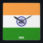 Horloge Carrée Drapeau de l'Inde Carré patriotique étincelant<br><div class="desc">Drapeau de l'Inde Horloge murale Carré patriotique étincelant dans les couleurs et les éléments du drapeau national indien couvrant l'avant de l'horloge. Les couleurs du drapeau national sont complétées par le texte "Inde" en bas. Le texte est entièrement personnalisable à l'aide de la fonction "Personnalisez-le !". N'hésitez pas à le...</div>