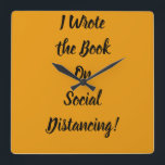 Horloge Carrée Écrit le livre sur la détresse sociale<br><div class="desc">slogan sarcastique sur la distance sociale et les vêtements de quarantaine. Apportez ceci à votre prochaine fête pour un amusant sarcasme ou un décor de maison amusant</div>