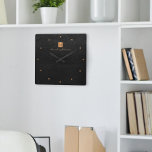 Horloge Carrée Élégant nom de monogramme en or noir personnalisé<br><div class="desc">Horloge murale de luxe monogrammed carré avec un arrière - plan en cuir noir et un carré en cuivre métallisé faux or brossé avec nom de signature de script élégant et initiales monogramme. Facile à personnaliser et à créer votre propre logo avec vos initiales et votre nom professionnels ou personnels....</div>