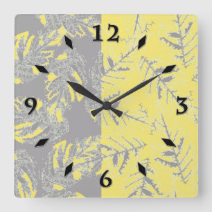 Horloge Carrée feuilles gris et jaunes sur un arrière - plan ray