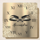 Horloge Carrée Gold Glitter Sparkle Eyelashes Monogram<br><div class="desc">Gold Faux Foil Metallic Sparkle Glitter Brushed Metal Monogram Name and Initial Eyelashes (Lashes),  Eyelash Extensions and Eyes cute wall clock. The design makes the perfect sweet 16 birthday,  wedding,  bridal shower,  anniversary,  baby shower or bachelorette party gift for someone looking for a trendy cool style.</div>