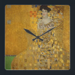 Horloge Carrée Gustav Klimt<br><div class="desc">Adele Bloch-Bauer I par Gustav Klimt. Beautiful painting of a beautiful woman with a lovely smile. Painted in golden colors with artistic values of art noveau. Available on many different gift ideas and wonderful products for art lovers. Check out our store for related products with this artwork and donc discover...</div>