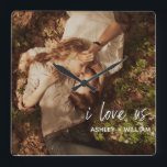 Horloge Carrée I Love Us Couple Quote Photo de Names<br><div class="desc">A beautiful way to celebrate your relationship, this photo acrylic design wall clock feels 'i love us in white lettered script overlay at the bottom right, followed by your names. To personalize, replace with your photo and edit the names field. Acrylic prints are a beautiful way to enjoy your images...</div>