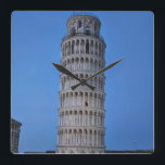 Horloge Carrée Leaning Tower at Dusk<br><div class="desc">This captivating photograph showcases the iconic Leaning Tower of Pisa standing elegantly against a deep blue twilight sky in Pisa. The historic marble tower, famous for its unmistakable tilt, is beautifully illuminated, highlighting its intricate Romanesque arches and layered columns. The soft evening light creates a striking contrast between the glowing...</div>