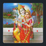 Horloge Carrée RADHA Krishna Flute Instrument Deity Holy<br><div class="desc">Style : Arrondi (Moyen) Il est temps de montrer votre art préféré, des photos et du texte avec une horloge murale personnalisée de Zazzle. Disponible en deux tailles, cette horloge est imprimée en utilisant le processus AcryliPrint®HD afin d'obtenir une qualité d'impression irréprochable. Cette horloge ronde est une idée cadeau originale...</div>