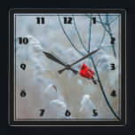 Horloge Carrée Red Cardinal dans Winter Nature Photo de Christmas<br><div class="desc">A clock with a scenic nature photograph featuring a bright red cardinal. Contrasted against a winter backdrop with snow gently falling down.</div>