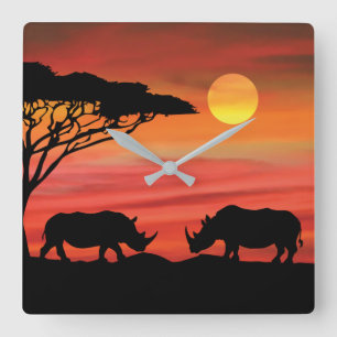 Horloge Carrée Rhinoceros dans le coucher du soleil du Serengeti