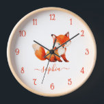 Horloge Couleur d'eau Fox mignonne rouge Script Nom de la<br><div class="desc">Pour la chambre d'un enfant. Au centre, il y a un mignon renard rouge. Sous l'illustration, le nom de l'enfant est écrit dans un script rouge. L'animal est généré avec DALL-E 2 de OpenAI. J'ai le droit d'utiliser mes générations pour n'importe quel usage légal, y compris à des fins commerciales,...</div>