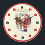 Horloge de Noël Vintage - Père Noël Nourriture Rei<br><div class="desc">Dessinée par l'artiste de l'Ohio Terri Meyer à partir d'une carte postale de Noël du début du siècle,  cette horloge représente Père Noël nourrissant son renne.  Une grande horloge murale pour les amateurs d'animaux,  Noël,  Père Noël et nostalgie !</div>