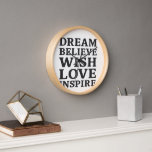 Horloge Dream Belive Wish Love Inspirer Motivational Wall<br><div class="desc">Ajoutez de l'inspiration quotidienne à n'importe quel espace avec cette horloge murale de motivation moderne avec les mots "Dream, Believe, Wish, Love, Inspire" en caractères gras. Parfait pour les bureaux à domicile, les chambres, les salons, ou comme un cadeau réfléchi pour les diplômés, les entrepreneurs ou toute personne qui poursuit...</div>