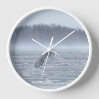 Hibou des neiges en vol en hiver