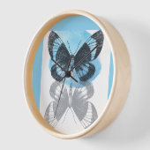 Horloge La magie des papillons bleus. (Angle)
