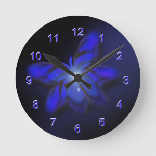Horloge murale bleue de papillon de lueur