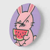Horloge murale de lapin mignon mangeant une carott (Angle)