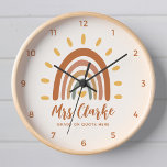 Horloge Nom de l'enseignant personnalisé Citation Boho Rai<br><div class="desc">Personnalisé Nom de l'enseignant Citation Boho Rainbow Sun Classroom horloge murale est un accessoire unique et élégant qui combine des éléments bohème et terreux avec un soleil arc-en-ciel vibrant. En plus du graphique frappant, l'horloge peut aussi être customisée avec votre nom d'enseignant, ainsi que la note ou toute autre citation,...</div>