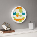 Horloge Orange Turquoise Blue Lime Green Retro Art Motif<br><div class="desc">Belle orange contemporaine, crème d'ivoire, blanc, vert citron et bleu turquoise demi-cercles géométriques ondulés et motif carré. Elégant, élégant et éclectique design minimalisme pour le décorateur artistique, décorateur artistique, branché populaire, style d'art rétro vintage ou abstrait amateur de motifs géométriques numériques. Associez ce design à vos couleurs de décoration intérieure...</div>