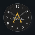 Horloge Ronde Black Gold Modern Script Girl Monogramme Nom<br><div class="desc">Black and Gold Simple Script Monogram Clock. This makes the perfect sweet 16 birthday,  wedding,  bridal shower,  anniversary,  baby shower or bachelorette party gift for someone that loves glam luxury and chic styles.</div>
