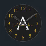 Horloge Ronde Black Gold Modern Script Girl Monogramme Nom<br><div class="desc">Black and Gold Simple Script Monogram Clock. This makes the perfect sweet 16 birthday,  wedding,  bridal shower,  anniversary,  baby shower or bachelorette party gift for someone that loves glam luxury and chic styles.</div>