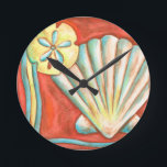 Horloge Ronde Coquillages Rustiques Orange<br><div class="desc">Posez-vous sur le sable chaud et trouvez les trésors cachés ! Cette peinture de Nancy Slocum capture la belle vie aquatique qui se trouve à terre. Il capture une belle coquille orange, une étoile de mer orange et un dollar de sable bleu vif. Obtenez votre magnifique art océanique dès aujourd'hui...</div>
